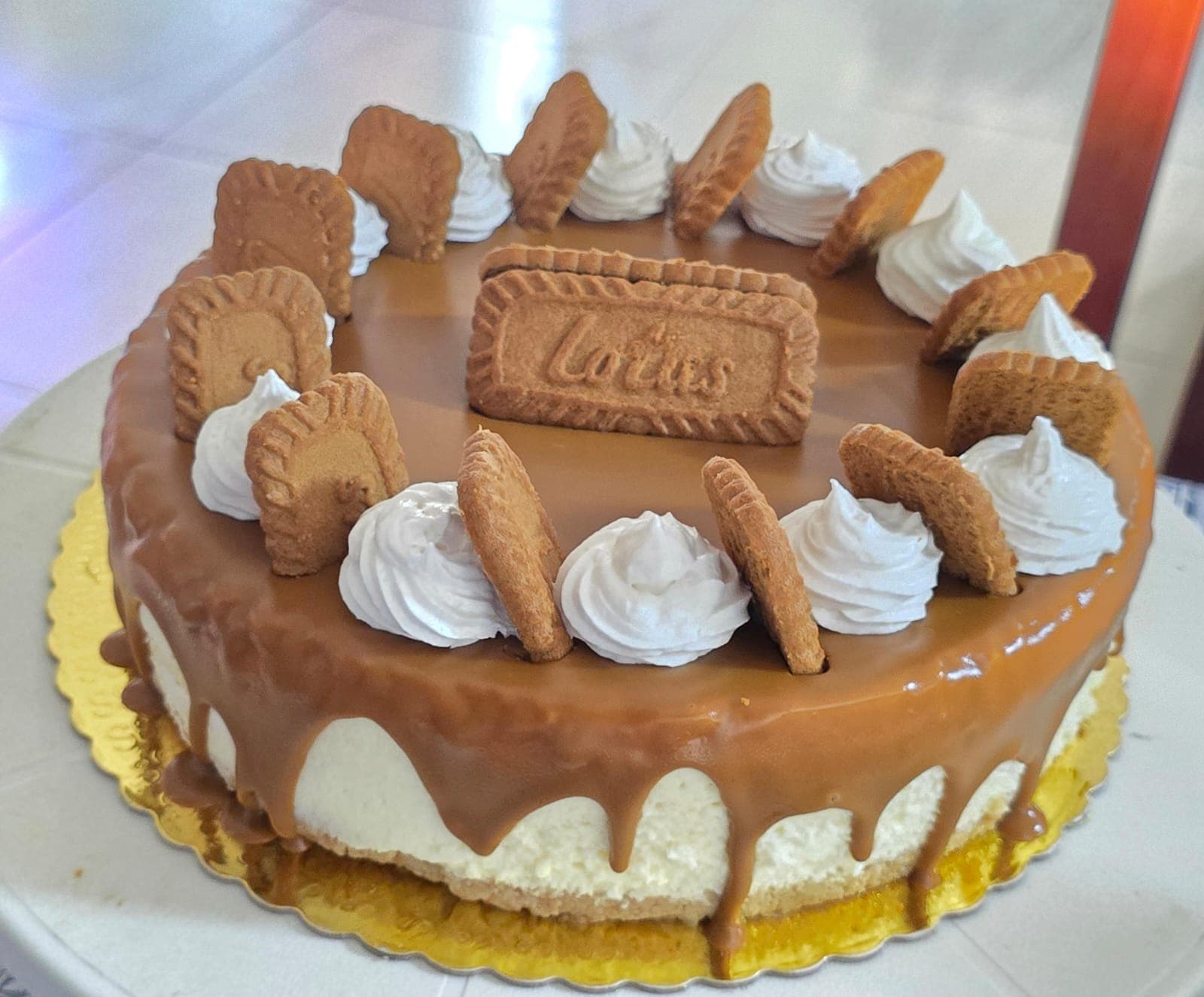 Lotus Biscoff Dream cheesecake crowned with Biscoff cookies and cream rosettes